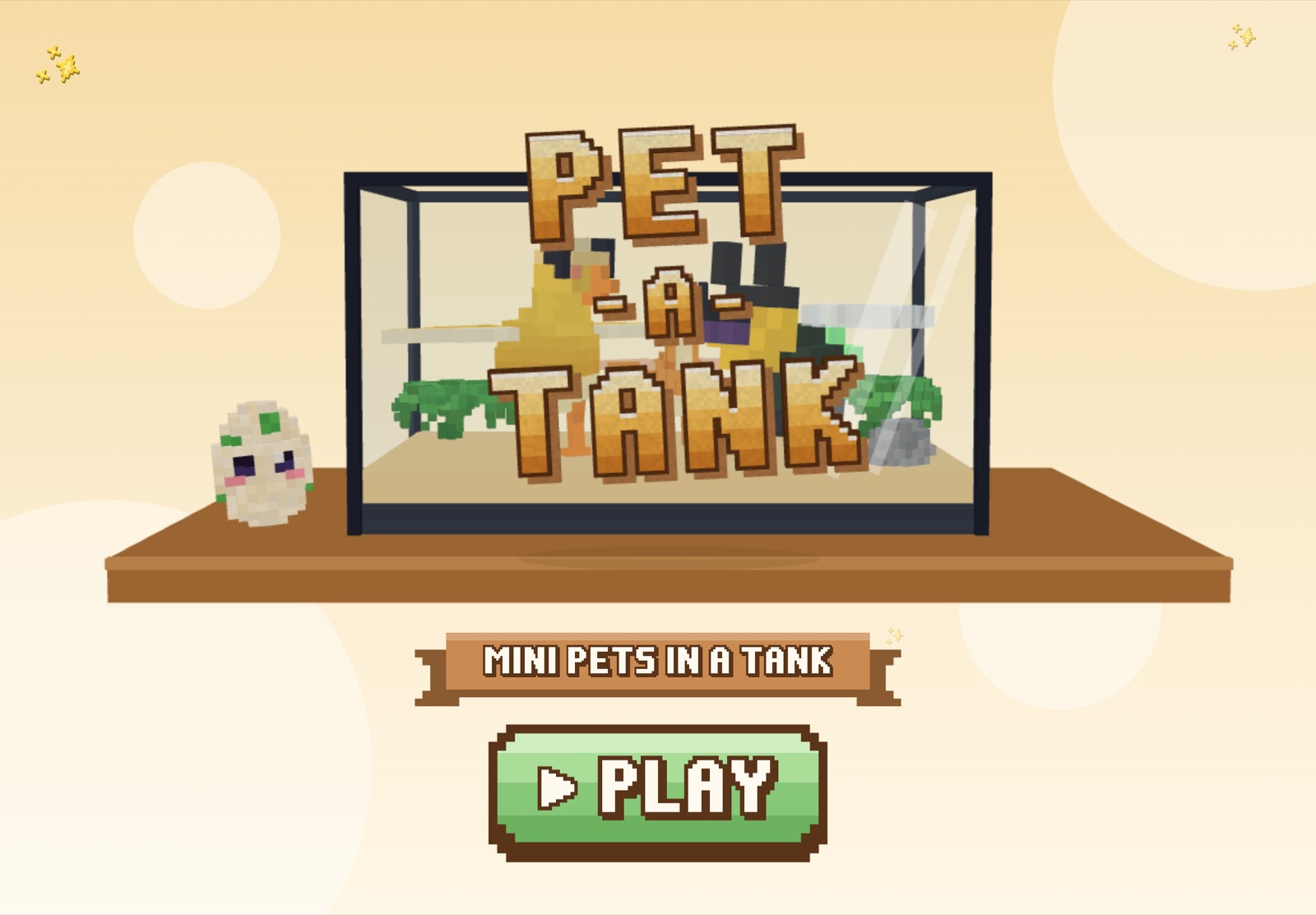 The Pet-a-Tank title screen: a glass tank on a shelf, a speckled egg and a big green Play button